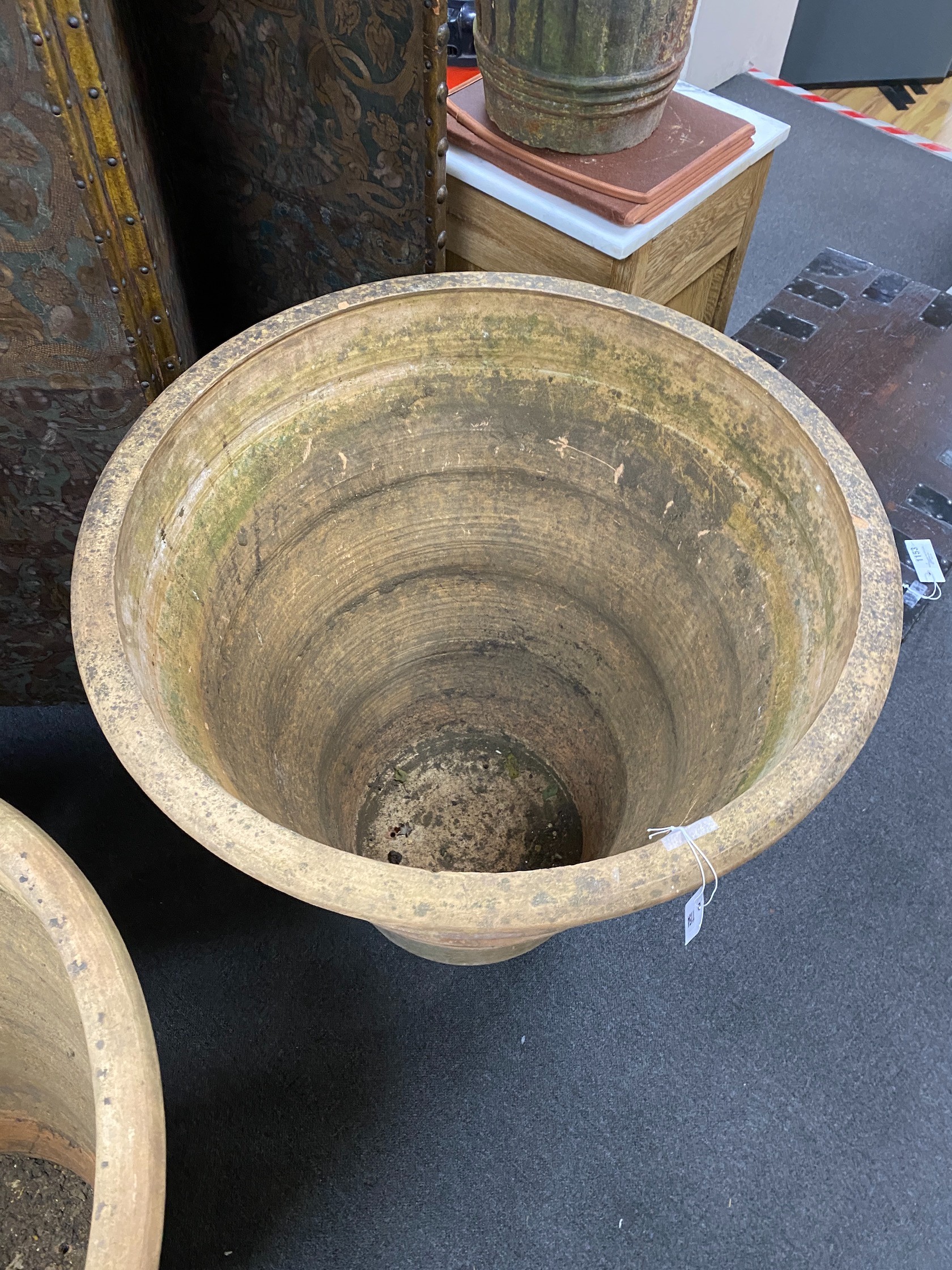 A near pair of Grecian style circular earthenware garden planters, larger diameter 82cm, height 82cm